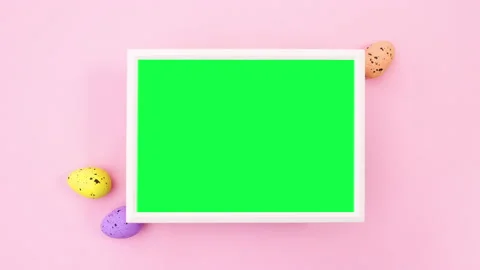 Easter eggs and frame with green screen on pink theme. Stop motion Stock Footage 148776017