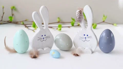 Easter eggs and funny bunnys. Easter eggs are rolling, knocking each other on Stock Footage 172608587