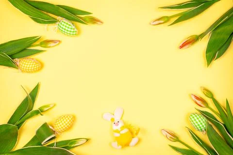 Easter eggs and a hare in a collection with white tender tulips.Background fo Stock Photos