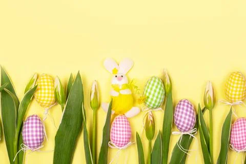 Easter eggs and a hare in a collection with white tender tulips. greeting card Stock Photos