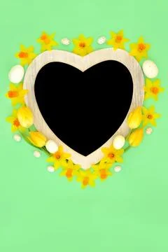 Easter Eggs and Heart Shape Frame with Spring Flowers Stock Photos