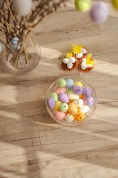 Easter eggs and the nests on rustic wooden background. Vertical photo Stock-Fotos