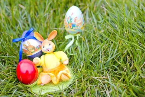 Easter eggs and rabbit hiding in the grass Stock Photos