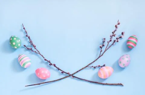 Easter eggs and sprigs of willow on a blue background, Easter, spring Stock Photos