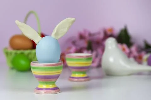Easter eggs and spring blooming flowers Stock Photos