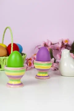 Easter eggs and spring blooming flowers Stock Photos