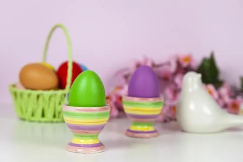 Easter eggs and spring blooming flowers Stock Photos