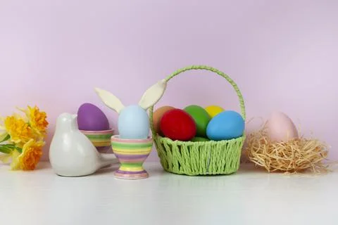 Easter eggs and spring blooming flowers Stock Photos