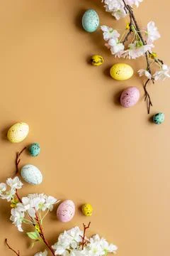 Easter eggs and spring flowers, top view Stock Photos