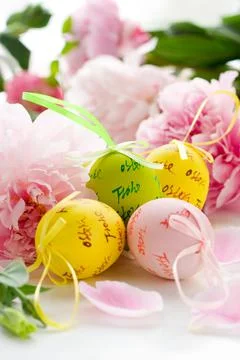 Easter eggs and spring flowers Stock Photos