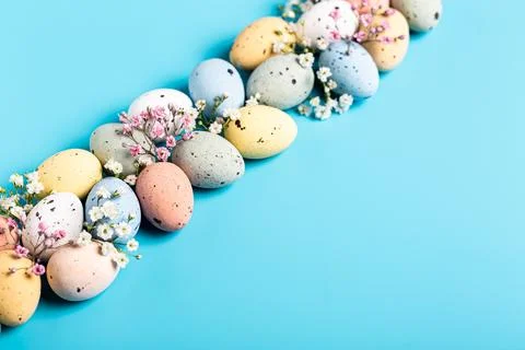 Easter eggs and spring flowers Stock Photos