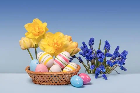 Easter eggs and spring flowers Stock Photos