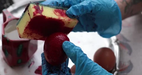 Easter eggs and step of egg painting process with vibrant red colors and Stock Footage 306067769