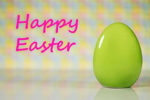 Easter eggs and tulips on colorful background, place for typography Stock Photos