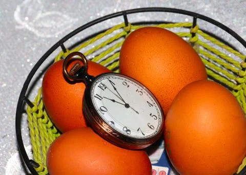 Easter eggs and watch 스톡 사진