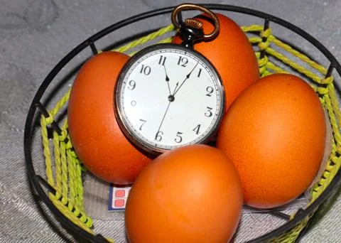 Easter eggs and watch 스톡 사진