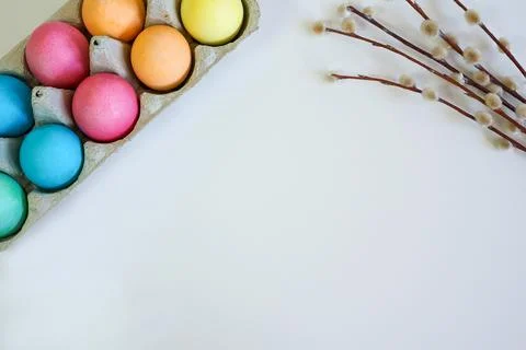 Easter eggs and willow branches on a white background Stock Photos