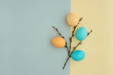 Easter eggs and willow twigs painted in pastel colors as a symbol of Easter on a Stock Photos