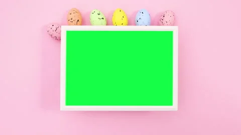 Easter eggs appear around frame with green screen. Stop motion Stock Footage 148774939