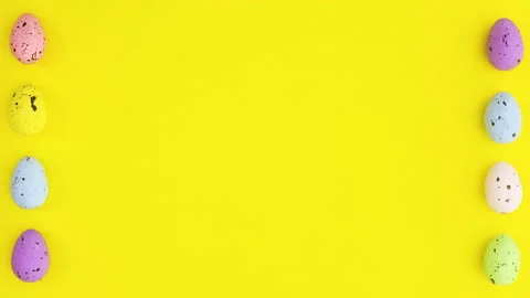 Easter eggs appear on left and right side of yellow theme. Stop motion Видео 149262341