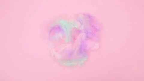 Easter eggs appear in nest of feathers. Stop motion Stock Footage 147742437