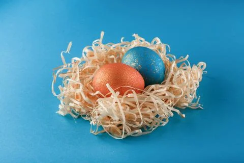 Easter eggs are painted blue with gold and orange gold. Stock-Fotos