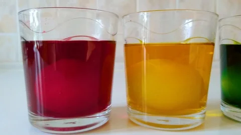 Easter eggs are painting in different colors Stock Footage 105375562