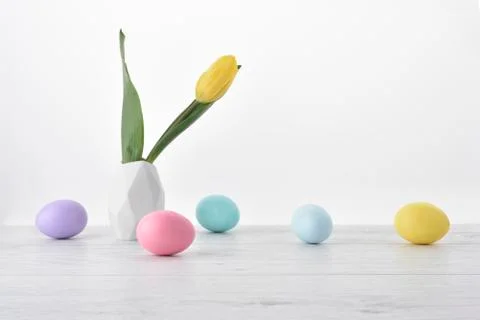 Easter eggs background with yellow tulip 스톡 사진