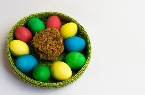 Easter eggs in a basket and nut cookies Stock Photos