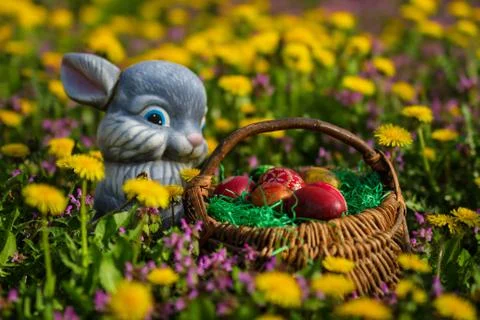Easter eggs in basket and rabbit Stock Photos