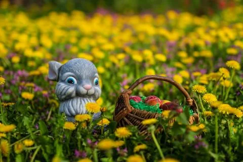 Easter eggs in basket and rabbit Stock Photos