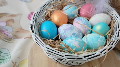 Easter eggs in a basket and toy rabbit. Easter composition. Holiday concept. Stock Footage 270718441