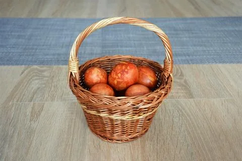 Easter eggs in the basket. Easter egg dyed with onion peel. Stock-Fotos
