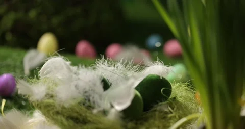 Easter eggs in basket, feathers falling down. Easter eggs and feathers in a Stock Footage 175439949