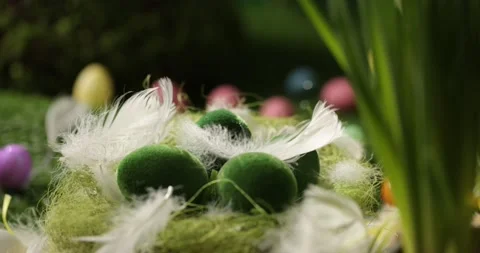 Easter eggs in basket, feathers falling down. Easter eggs and feathers in a Stock Footage 175441609