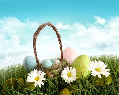 Easter eggs with basket in the grass Stock Photos