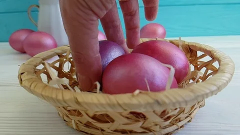 Easter eggs in a basket hand holding a slow shot Video stock 90308413