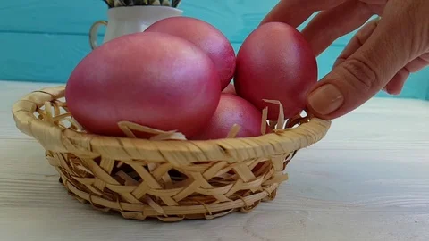 Easter eggs in a basket hand holding a slow shot Video stock 90308460