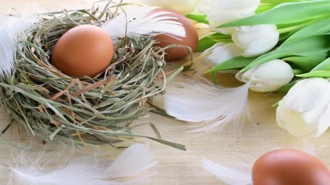 Easter eggs basket. Natural colour egg in basket with spring tulips Stock Footage 146483541