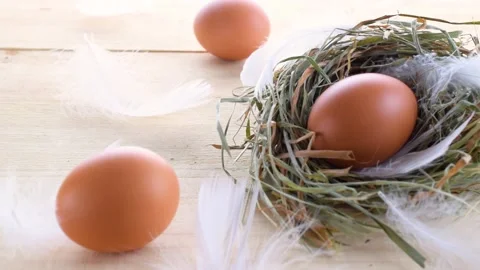 Easter eggs basket. Natural colour egg in basket with spring tulips Stock Footage 147968187