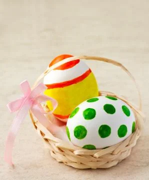 Easter eggs in basket Stock Photos