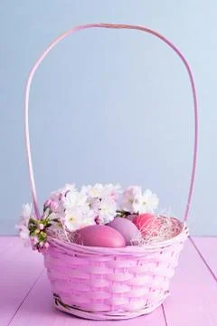 Easter eggs in basket Stock Photos