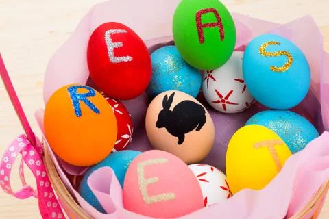 Easter eggs in basket Stock Photos