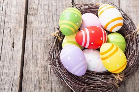 Easter eggs in basket Stock Photos