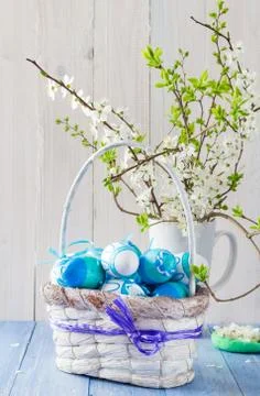 Easter eggs basket spring branches Stock Photos