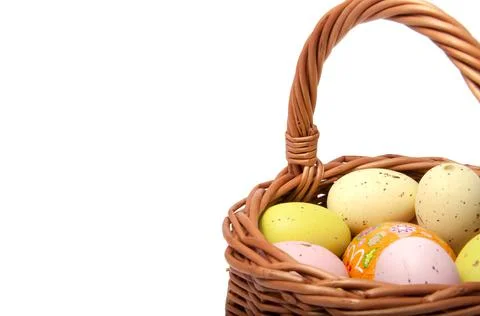 Easter eggs in the basket on white background Stock Photos