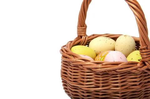 Easter eggs in the basket on white background Stock Photos