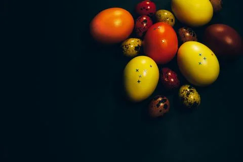 Easter eggs on black background. Copy space Stock Photos