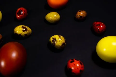 Easter eggs on black background. Copy space Stock Photos