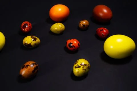 Easter eggs on black background. Copy space Stock Photos
